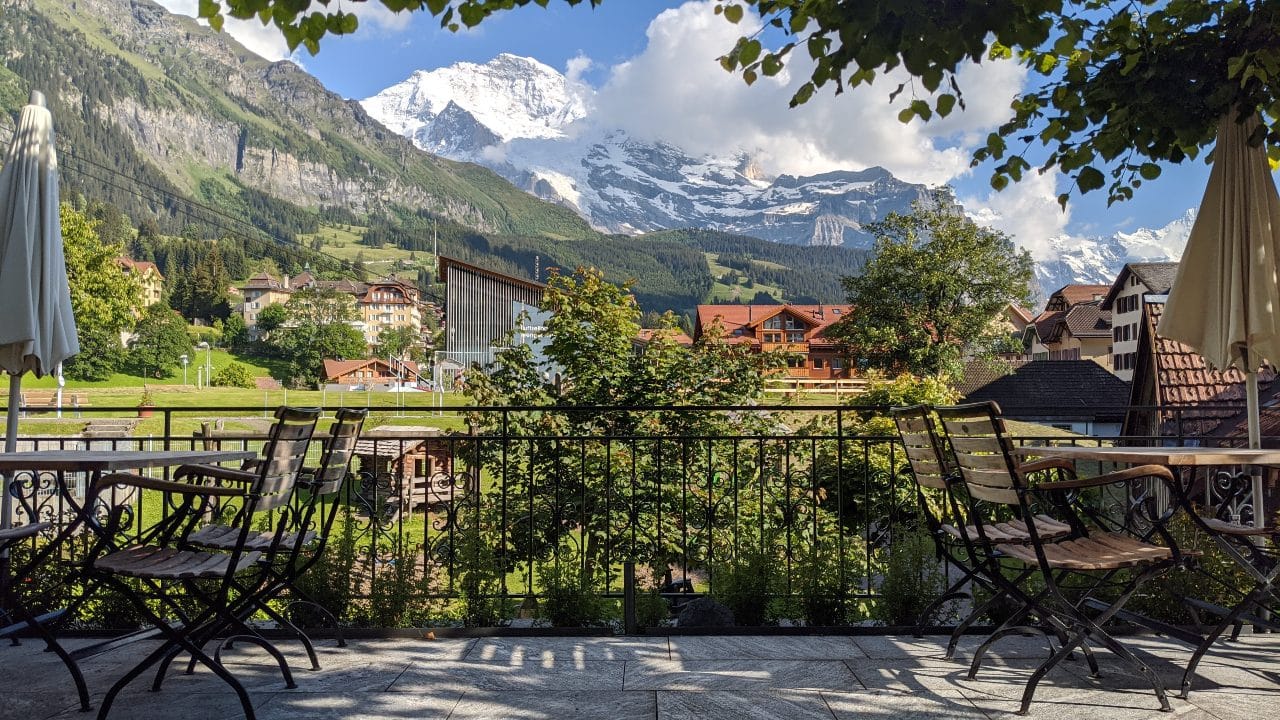 The terrace of hotel Schoenegg in Wengen, Switzerland with a view to mount Jungfrau