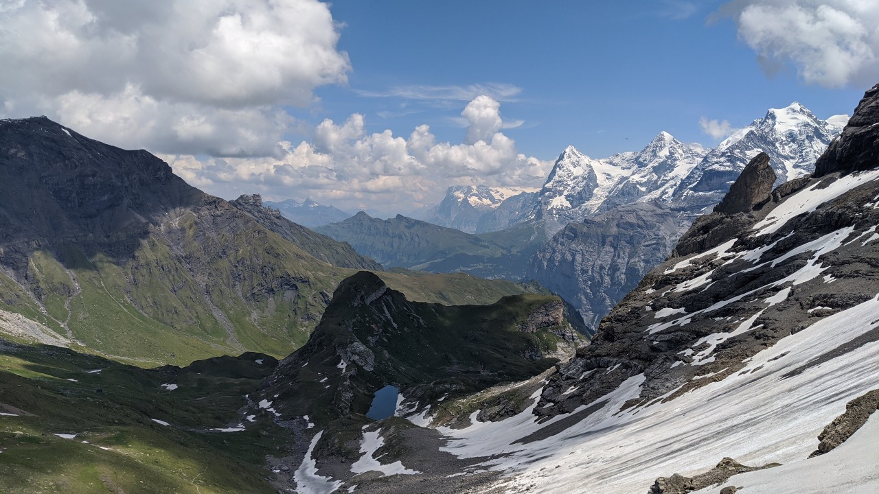 View of Schilthorn (left), the Eiger, the Mönch and the Jungfrau from Via Alpina hiking trail to Sefinenfurgge mountain pass.