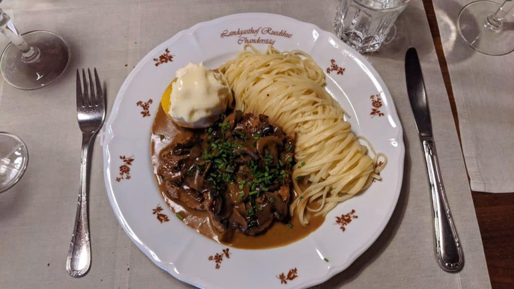 Traditional Swiss dish: Sliced pork in a cream sauce with butter noodles